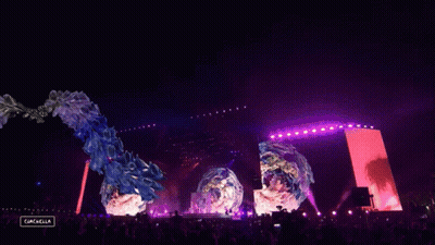 A Crowd Of People At A Music Festival With A Sign That Says Gazelle GIF