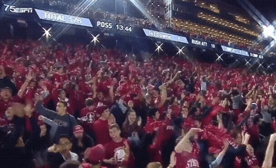 A Crowd Of People In A Stadium With A Scoreboard That Says ' Total 178 ' On It GIF