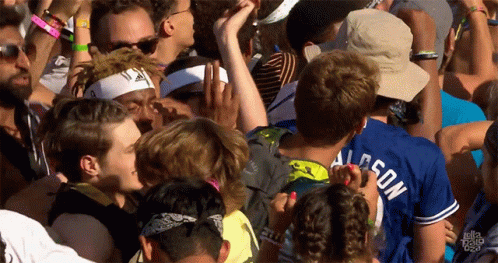 A Crowd Of People Including A Man Wearing A Shirt That Says Allison GIF
