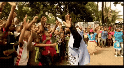 A Crowd Of People Including A Man Wearing A Shirt That Says ' Rsr ' On It GIF