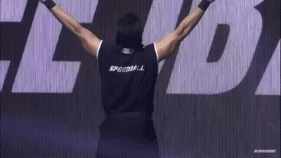 A Crowd Of People Standing In Front Of A Stage With A Sign That Says ' Subscribe ' On It GIF