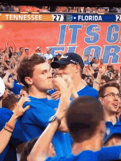 A Crowd Of People Watching A Game Between Tennessee And Florida With The Score 27 To 21 GIF
