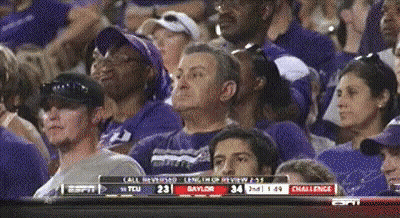 A Crowd Of People Watching A Game With Espn On The Bottom GIF