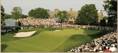 A Crowd Of People Watching A Golf Course With A Scoreboard In The Background GIF