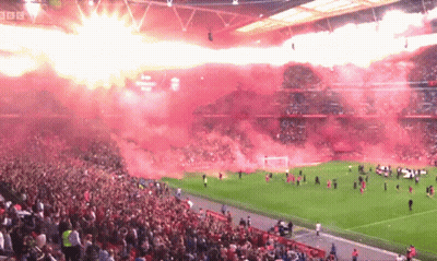 A Crowd Of People Watching A Soccer Game With Bbc Written On The Bottom GIF