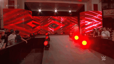 A Crowd Of People Watching A Wrestling Show With The Hashtag #Wweukct On The Screen GIF