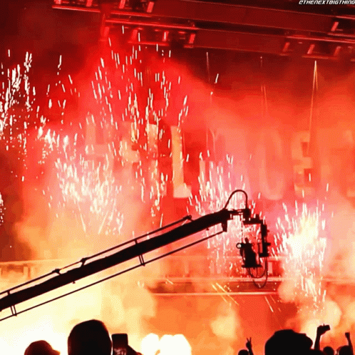 A Crowd Of People Watching Fireworks With The Words " The Next Thing " On The Bottom Right GIF