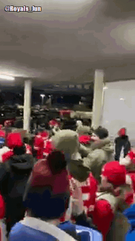 A Crowd Of People Wearing Red Hats Are Gathered In A Room With The Hashtag Royals Jun GIF