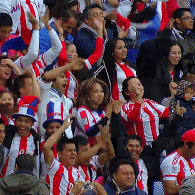 A Crowd Of People Wearing Red White And Blue Striped Shirts With The Letter O On The Front GIF