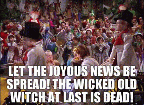 A Crowd Of People With The Words Let The Joyous News Be Spread ! The Wicked Old Witch At Last Is Dead ! GIF
