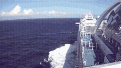 A Cruise Ship Is Floating In The Ocean With The Letters R And T On The Side GIF