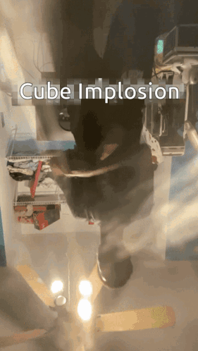 A Cube Implosion Is Displayed In A Room GIF