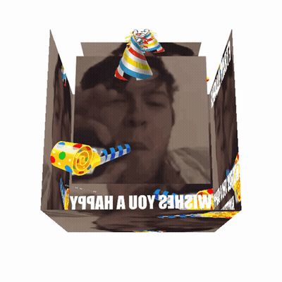 A Cube With A Picture Of A Man And The Words " Y9cah A Uoy 23H " Written On It GIF