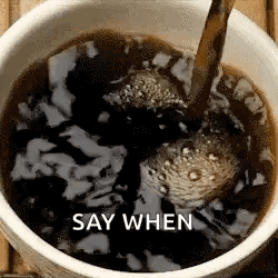 A Cup Of Coffee Is Being Poured Into A Bowl With The Words `` Say When '' Written On The Bottom . GIF