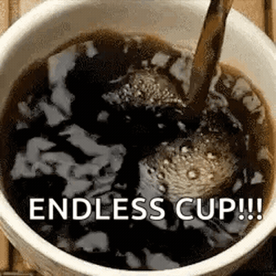 A Cup Of Coffee Is Being Poured Into A Cup On A Table . GIF