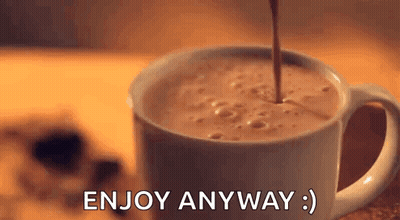 A Cup Of Coffee Is Being Poured Into A Cup With The Words `` Enjoy Anyway '' Written On It . GIF