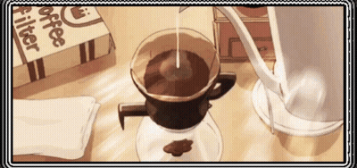 A Cup Of Coffee Is Being Poured Into A Glass Cup On A Table . GIF
