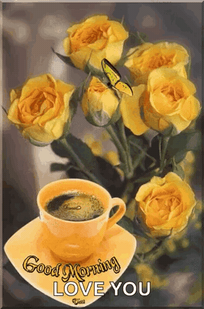 A Cup Of Coffee Is On A Saucer Next To A Bunch Of Yellow Roses . GIF