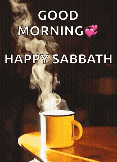 A Cup Of Coffee Is Sitting On A Wooden Table With Smoke Coming Out Of It And The Words `` Good Morning Happy Sabbath ''  GIF