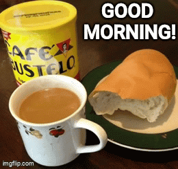 A Cup Of Coffee Next To A Can Of Cafe Bustelo And A Half Eaten Loaf Of Bread On A Plate GIF