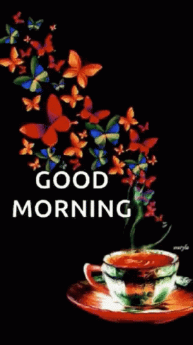 A Cup Of Coffee On A Saucer With Butterflies Flying Around It . GIF