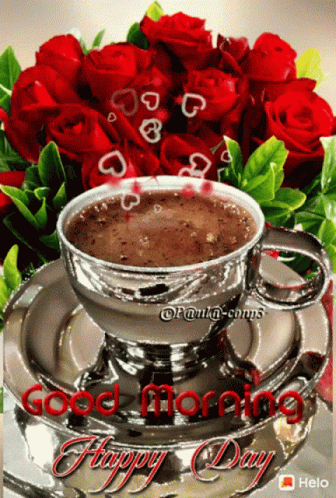 A Cup Of Coffee Sits On A Saucer Next To Red Roses GIF