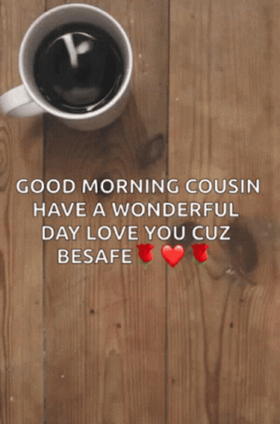 A Cup Of Coffee Sits On A Wooden Table Next To A Good Morning Message GIF