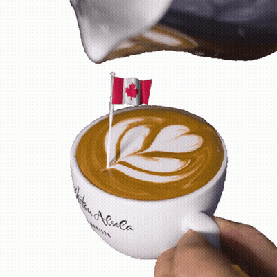 A Cup Of Coffee With A Canadian Flag On Top Of It GIF