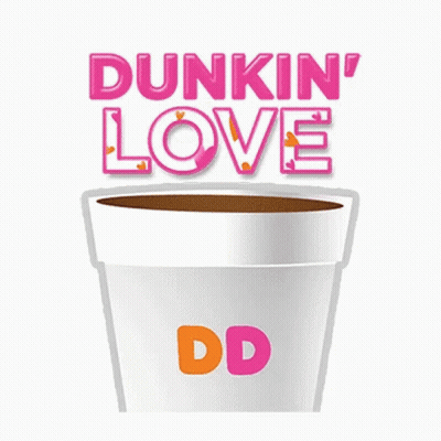 A Cup Of Coffee With A Heart Shaped Doughnut In It GIF