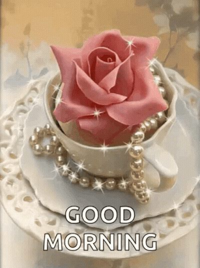 A Cup Of Coffee With A Pink Rose And Pearls On A Saucer With The Words `` Good Morning '' . GIF