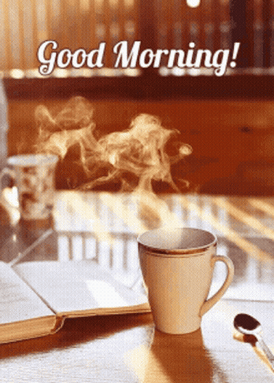 A Cup Of Coffee With Steam Coming Out Of It And The Words " Good Morning " GIF