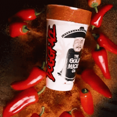 A Cup That Says ' The Gold Mich Co ' On It Surrounded By Red Peppers GIF