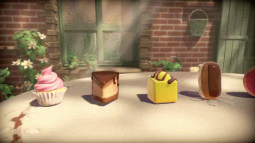 A Cupcake With Pink Frosting Sits On A Table Next To A Slice Of Cake GIF