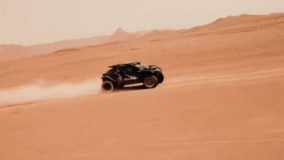 A Dacia Vehicle Is Driving Through A Desert GIF