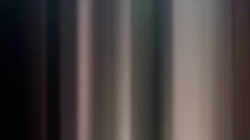 A Dark Background With A Few Lines Of Light Coming Out Of It GIF
