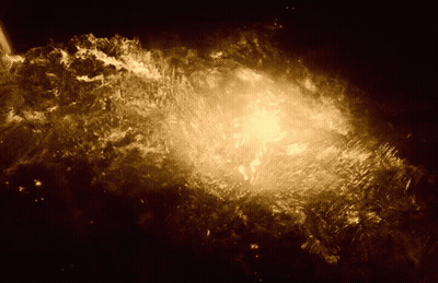 A Dark Background With A Glowing Object In The Center GIF