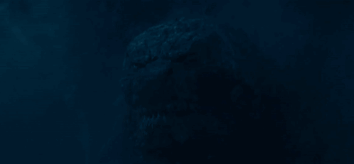 A Dark Blue Background With A Silhouette Of A Person In The Dark GIF