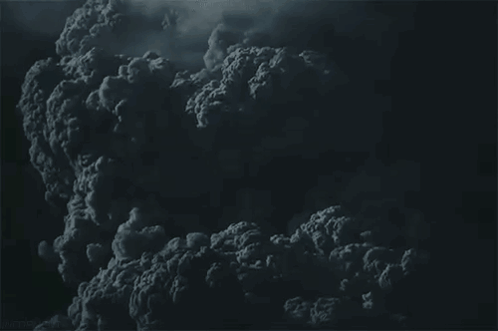 A Dark Cloudy Sky With A Lot Of Smoke Coming Out Of It . GIF