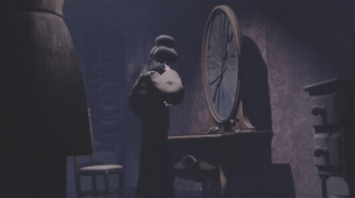 A Dark Room With A Clock In The Background GIF