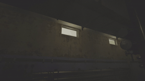 A Dark Room With A Few Windows And A Pipe GIF