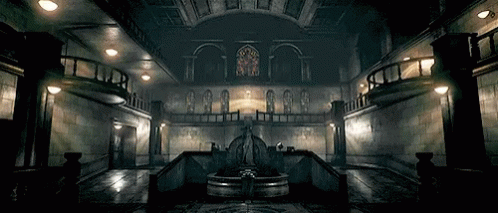 A Dark Room With A Fountain In The Middle GIF