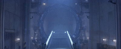 A Dark Room With A Light Coming Out Of A Hole In The Wall GIF