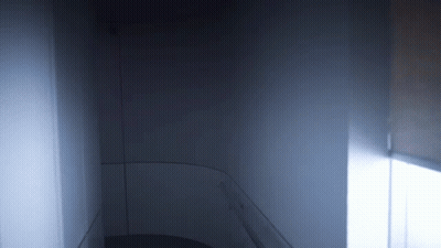 A Dark Room With A Light Coming Out Of The Window GIF