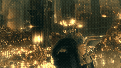 A Dark Room With A Lot Of Gold Objects GIF