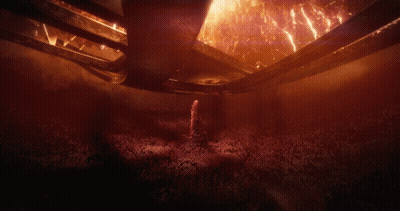 A Dark Room With A Lot Of Smoke And Flames GIF