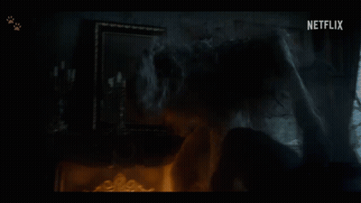 A Dark Room With A Netflix Logo On The Bottom Left GIF