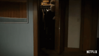 A Dark Room With A Netflix Logo On The Corner GIF