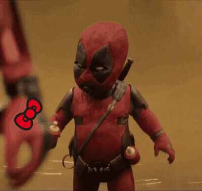 a deadpool doll is holding a hello kitty bow
