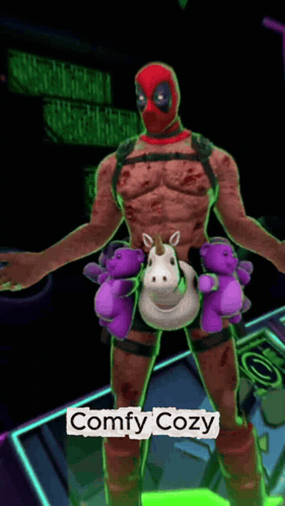 A Deadpool Holding A Stuffed Unicorn And Teddy Bears With The Words Comfy Cozy Below Him GIF