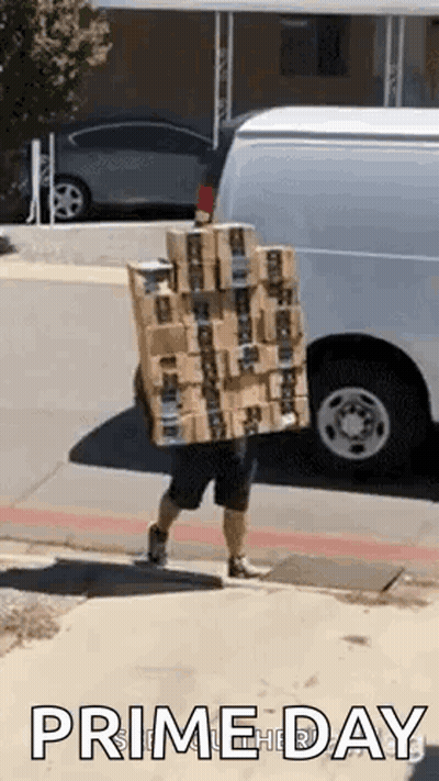 A Delivery Man Is Carrying A Stack Of Boxes On His Back . GIF